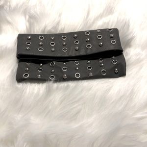 Gray leather clutch purse with silver accents